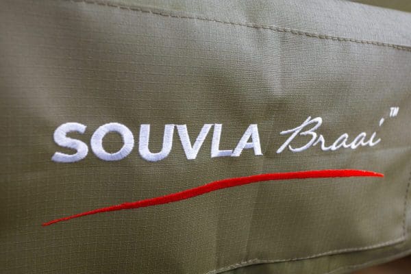 Souvla braai cover closeup of logo