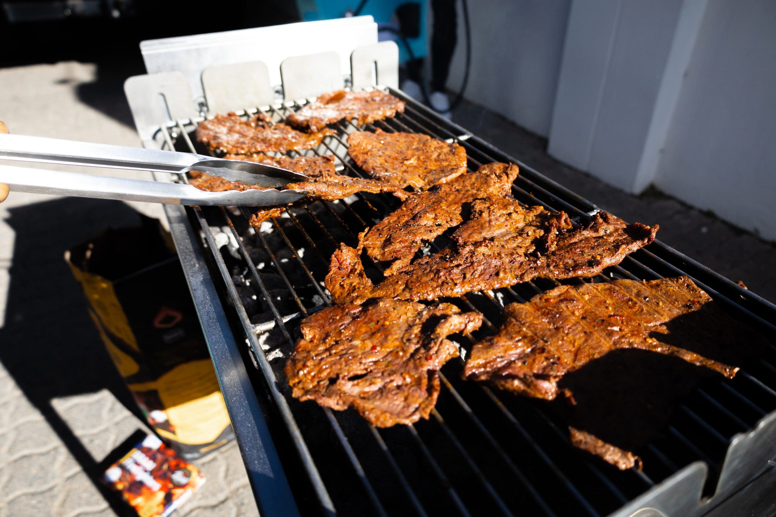 Beef pregos made on a souvla braai flat grill